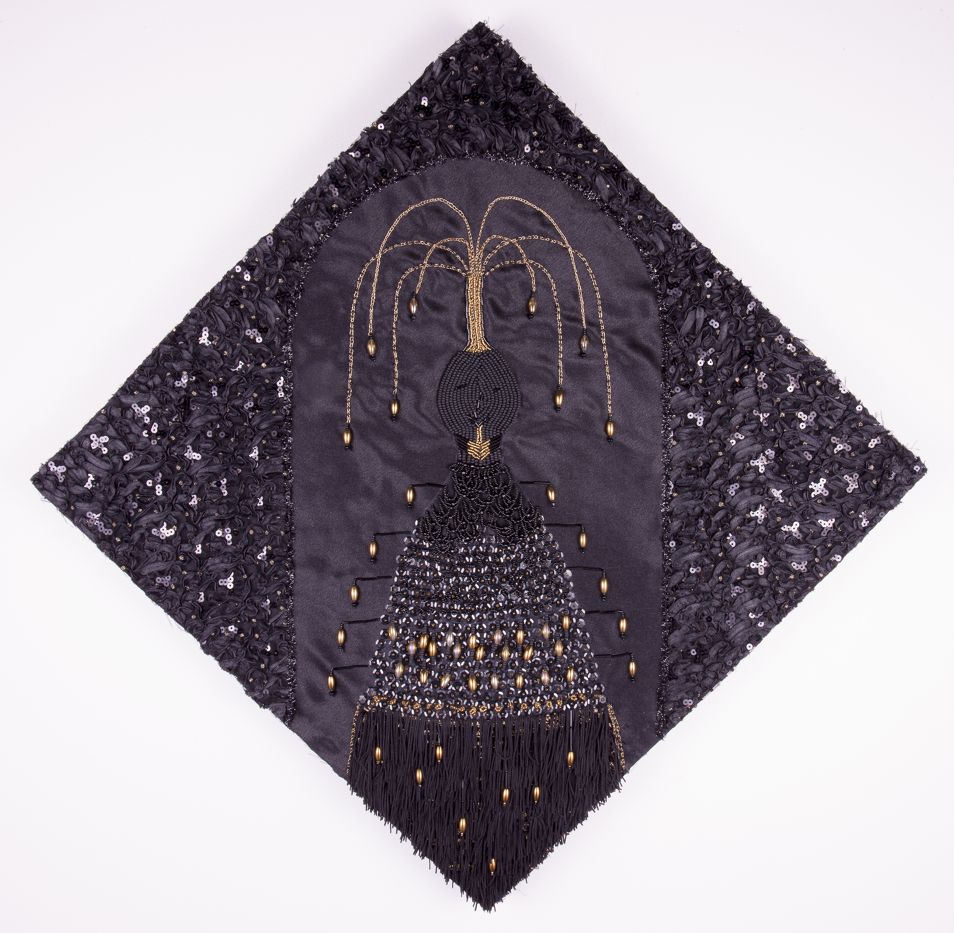 A mixed media collage of glass beads, sequins, upcycled fabric, metallic thread, cotton thread, trim, and osnaburg fabric.