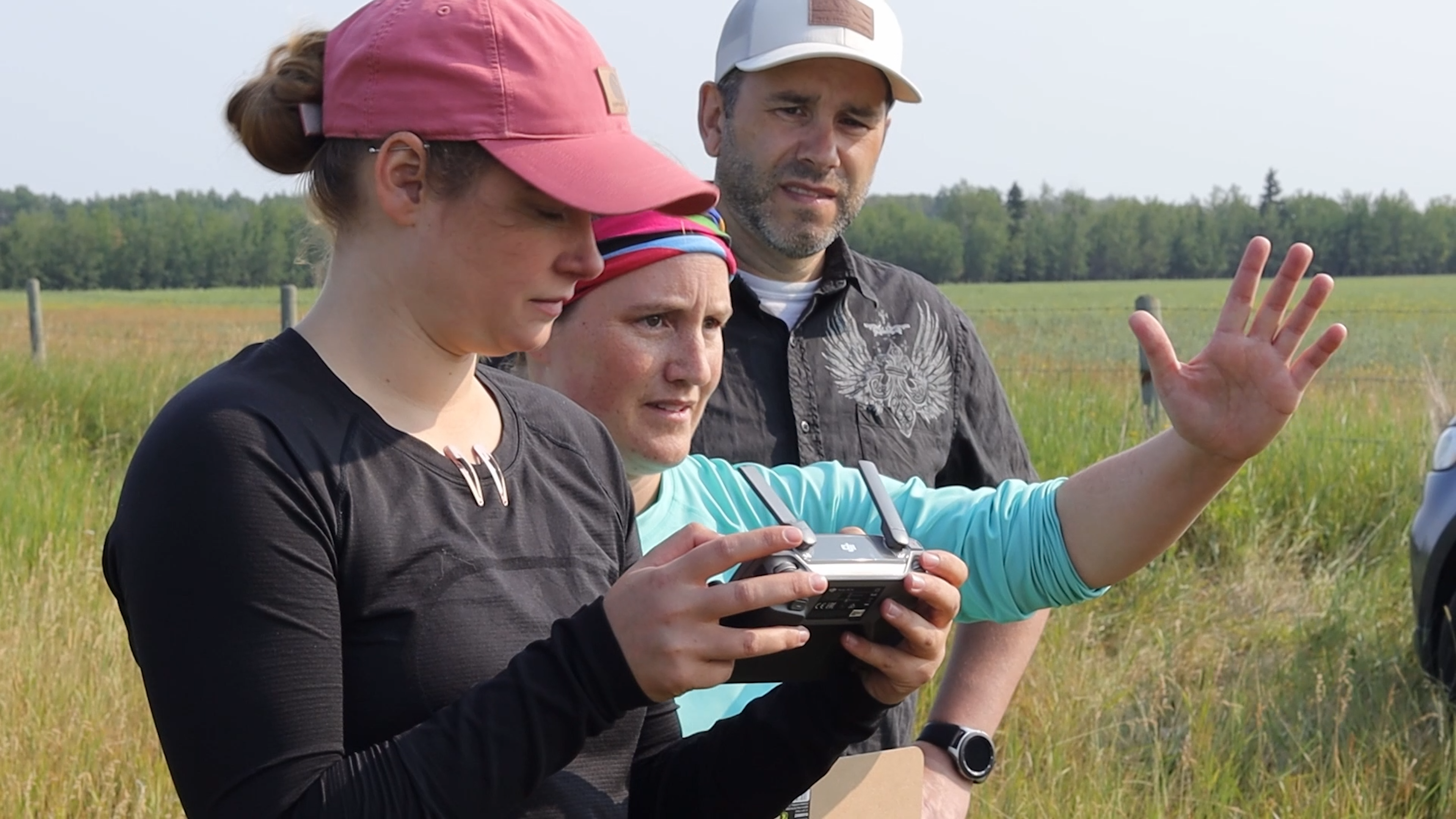 Sonja Jarrett, middle, is filming her movie on location with two crew members.