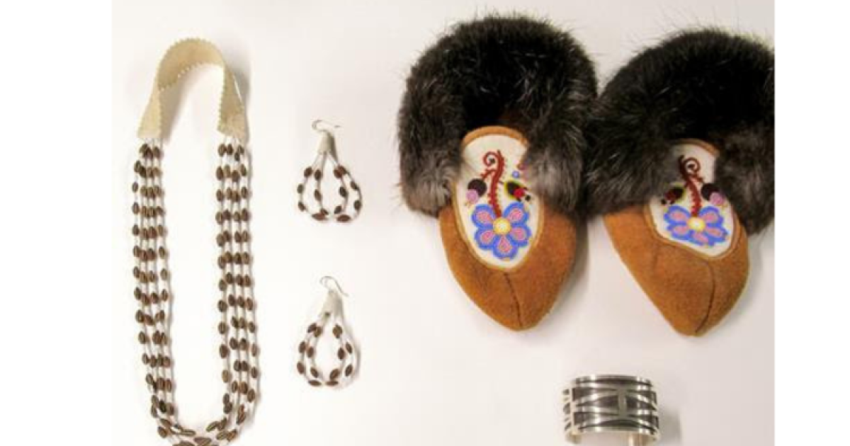 A collection of traditional Indigenous items included a beaded necklace, earrings, bracelet and moccasins laid out on a white background