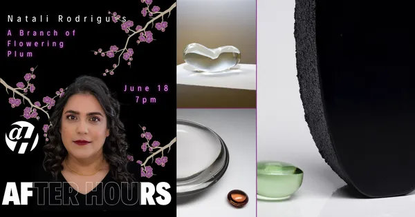 Natali Rodrigues is wearing a black blouse set against a black background and flowers.